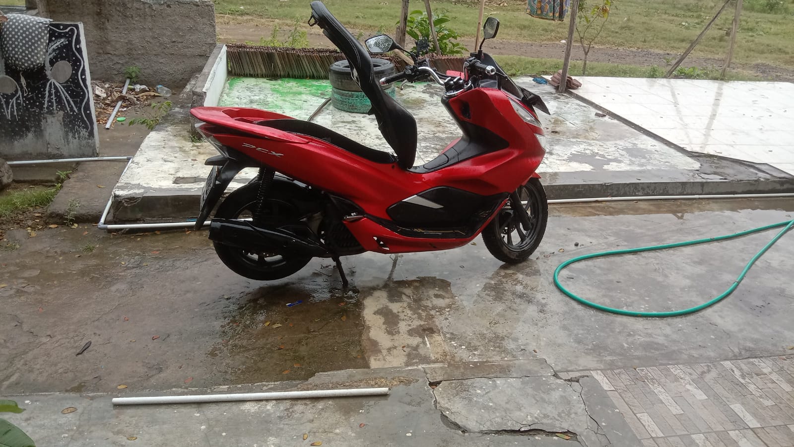 Black Yamaha NMAX scooter side view